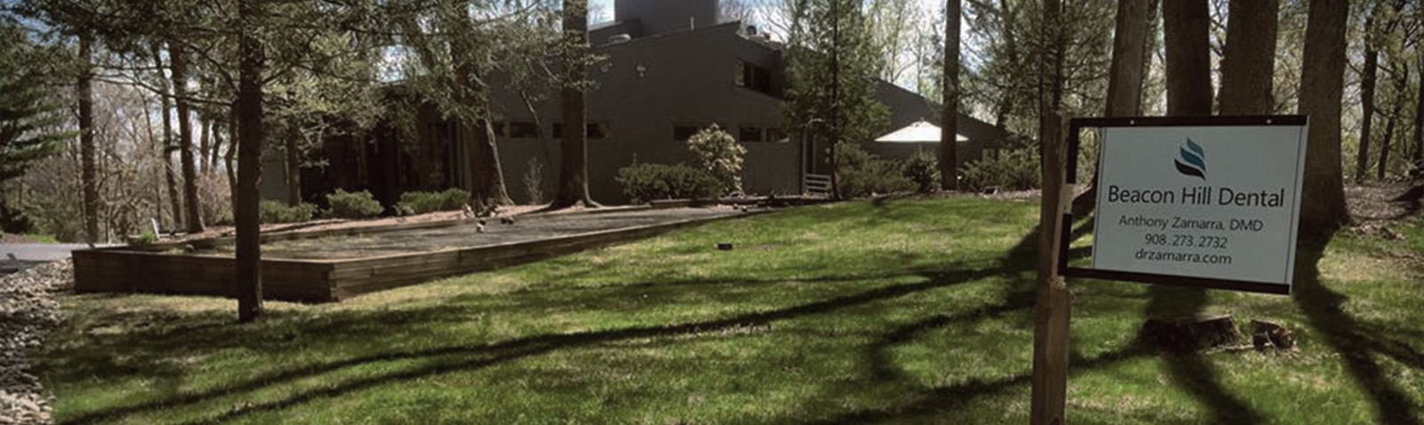 The image shows a sign in front of a building with the text Seasonal Dental visible, indicating that this location is associated with dental care services.